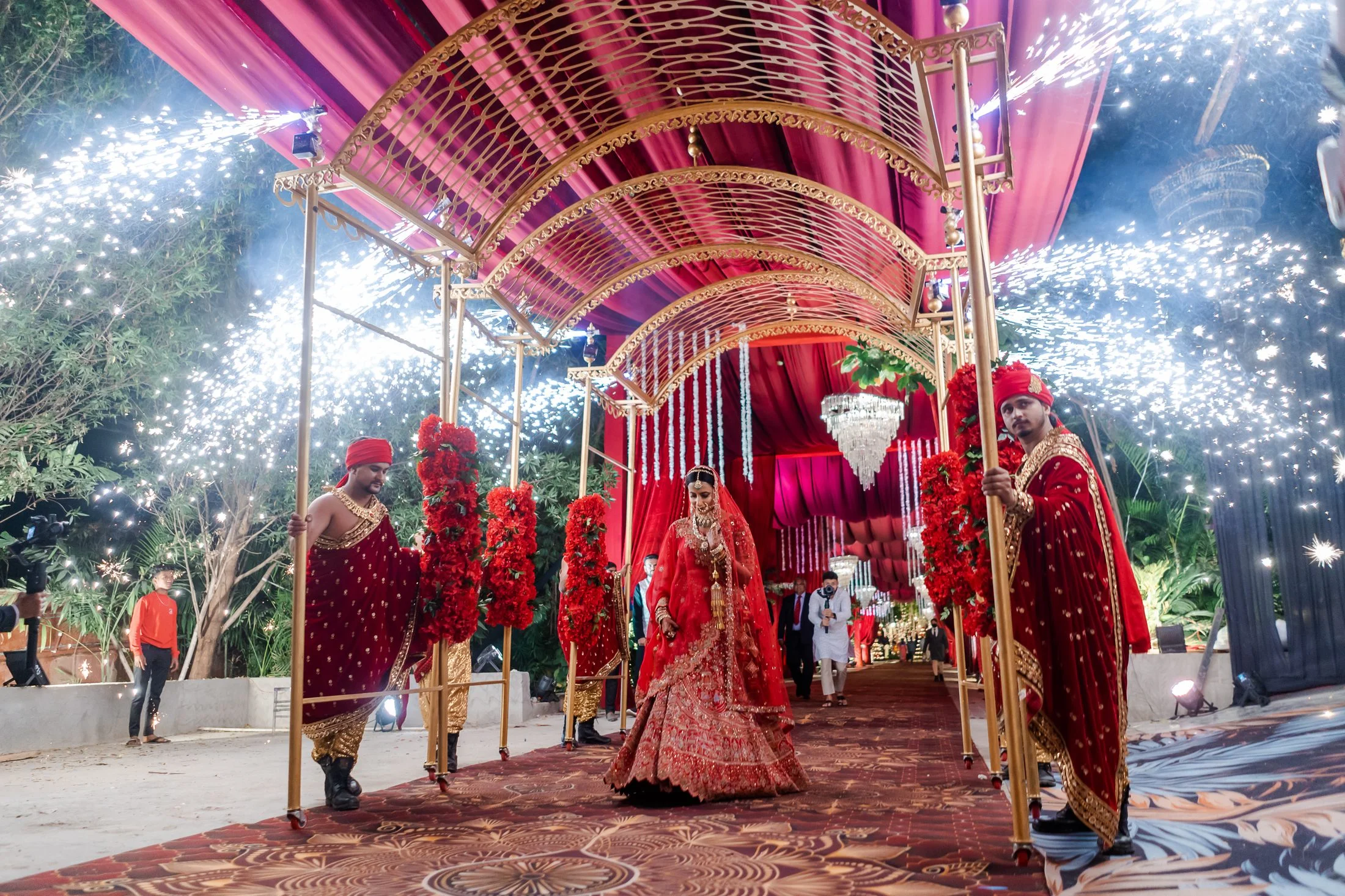 Bride's grand entrance under a floral canopy